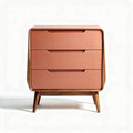 Mid-century modern nightstand with three storage drawers in coral finish